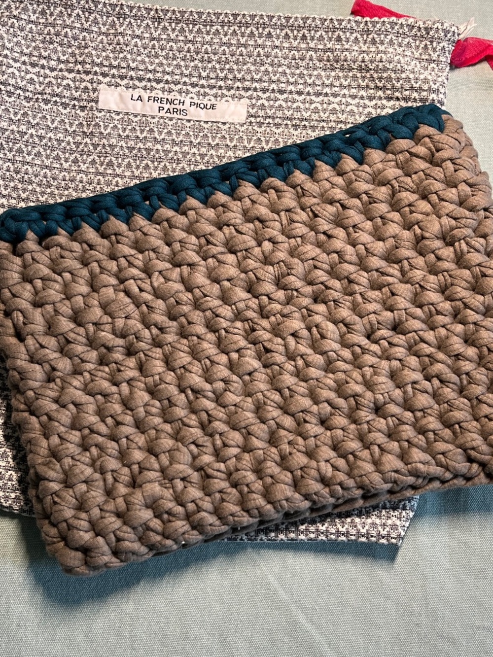 NWOT Le French Pique Woven Clutch Bag New, never used.